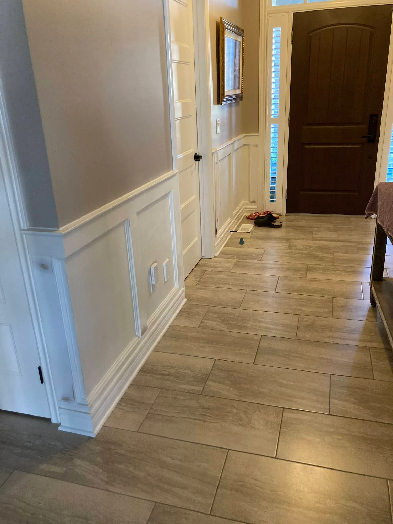 Freshly painted hallway with white doors and trim