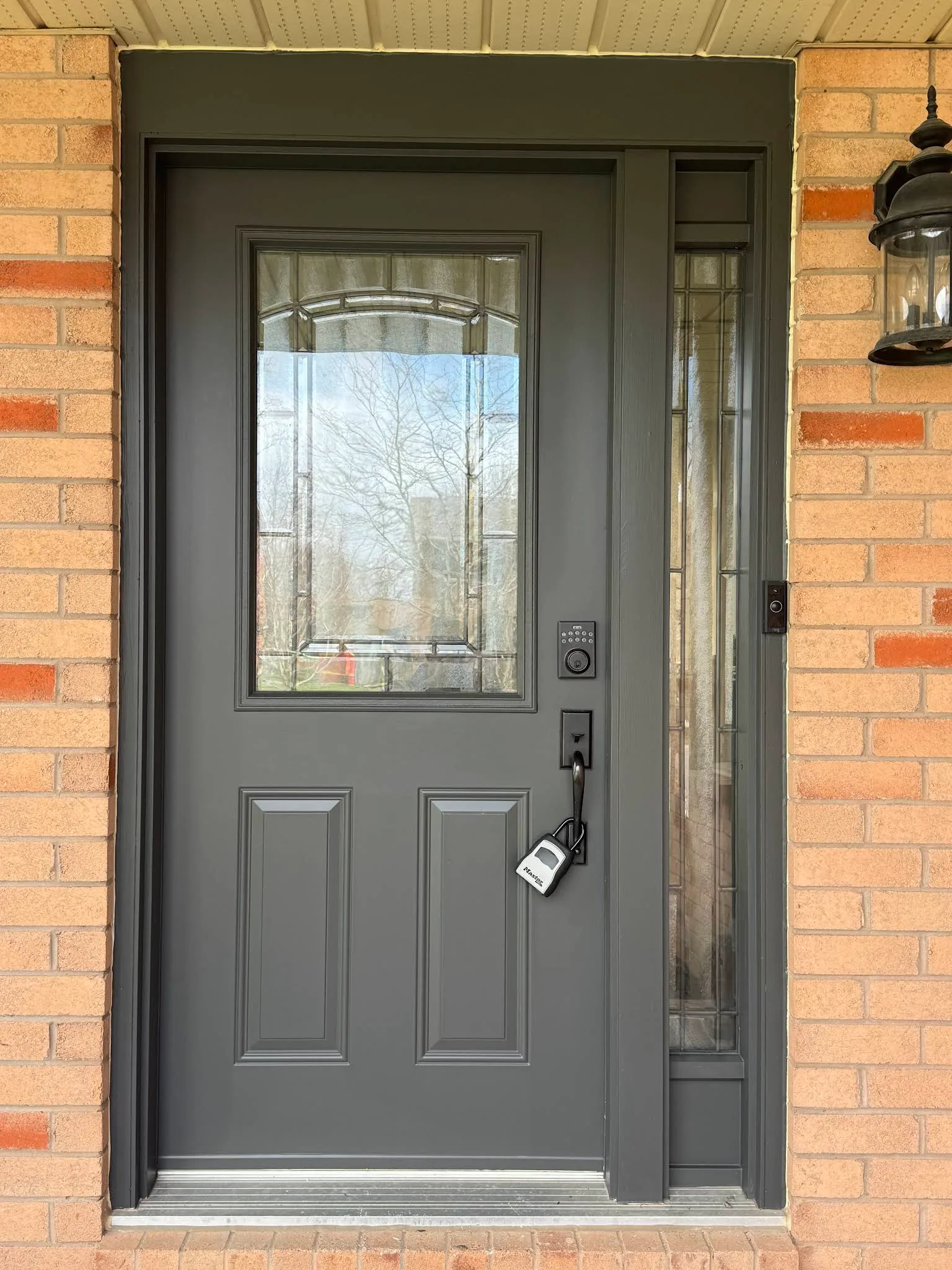 Single exterior entry door freshly painted charcoal grey